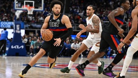 Feb 27, 2026; Detroit, Michigan, USA; Detroit Pistons guard Cade Cunningham (2) drive past Cleveland Cavaliers guard Jaylon Tyson (20) in the first half at Little Caesars Arena.