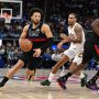 Feb 27, 2026; Detroit, Michigan, USA; Detroit Pistons guard Cade Cunningham (2) drive past Cleveland Cavaliers guard Jaylon Tyson (20) in the first half at Little Caesars Arena.