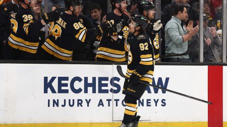 Mar 3, 2026; Boston, Massachusetts, USA; Boston Bruins center Marat Khusnutdinov (92) is congratulated at the bench by right wing David Pastrnak (88) after scoring against the Pittsburgh Penguins during the first period at TD Garden.