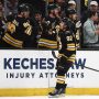 Mar 3, 2026; Boston, Massachusetts, USA; Boston Bruins center Marat Khusnutdinov (92) is congratulated at the bench by right wing David Pastrnak (88) after scoring against the Pittsburgh Penguins during the first period at TD Garden.
