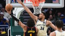 Mar 4, 2026; Milwaukee, Wisconsin, USA; Milwaukee Bucks forward Giannis Antetokounmpo (34) tries to block a shot by Atlanta Hawks forward Jalen Johnson (1) in the second quarter at Fiserv Forum.