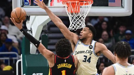 Mar 4, 2026; Milwaukee, Wisconsin, USA; Milwaukee Bucks forward Giannis Antetokounmpo (34) tries to block a shot by Atlanta Hawks forward Jalen Johnson (1) in the second quarter at Fiserv Forum.