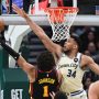 Mar 4, 2026; Milwaukee, Wisconsin, USA; Milwaukee Bucks forward Giannis Antetokounmpo (34) tries to block a shot by Atlanta Hawks forward Jalen Johnson (1) in the second quarter at Fiserv Forum.