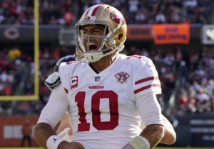 San Francisco 49ers quarterback Jimmy Garoppolo reacts after scoring a touchdown against the Chicago Bears