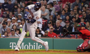 Houston Astros outfielder Yordan Alvarez swings at a pitch in a game at Fenway Park in Boston