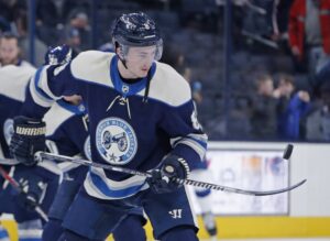 Columbus Blue Jackets defenseman Zach Werenski balances the puck on his hockey stick