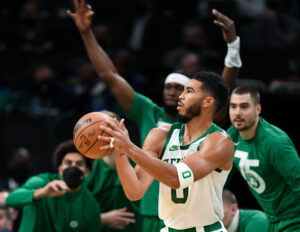 Boston Celtics player Jayson Tatum prepares to shoot the ball