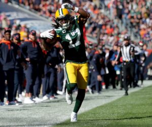 Green Bay Packers wide receiver Davante Adams tries to stay in bounds after a catch