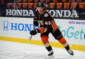 Anaheim Ducks center Trevor Zegras skates toward the puck during a game