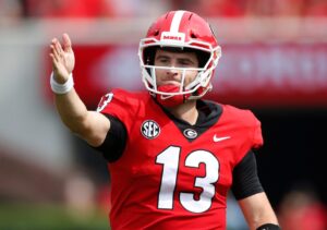 Georgia quarterback Stetson Bennett gestures for a first down during a game