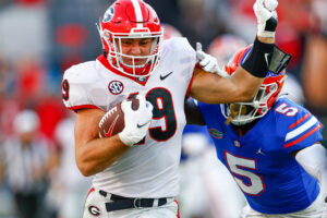 Georgia Bulldogs tight end Brock Bowers is forced out of bounds by Florida Gators cornerback Kaiir Elam