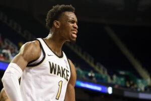 Isaiah Mucius #1 of the Wake Forest Demon Deacons reacts following a play against the Pittsburgh Panthers during their game in the first round of the 2020 Men's ACC Basketball Tournament at Greensboro Coliseum on March 10, 2020 in Greensboro, North Carolina.