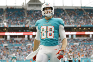 Mike Gesicki #88 of the Miami Dolphins celebrates after a touchdown against the Cincinnati Bengals during the second quarter at Hard Rock Stadium on December 22, 2019 in Miami, Florida.