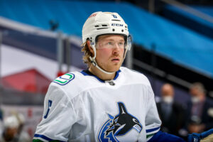 Brock Boeser #6 of the Vancouver Canucks looks on during a second period stoppage in play against the Winnipeg Jets at the Bell MTS Place on May 11, 2021 in Winnipeg, Manitoba, Canada.