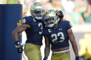 Notre Dame Fighting Irish running back Kyren Williams (23) celebrates with Notre Dame Fighting Irish wide receiver Avery Davis (3) and teammates after scoring a touchdown during a game between the Notre Dame Fighting Irish and the Purdue Boilermakers on September 18, 2021, at Notre Dame Stadium, in South Bend, In