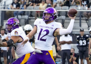  East Carolina Pirates quarterback Holton Ahlers (12)drops back to pass the ball during the football game between the UCF Knights and East Carolina on October 9th, 2022 at Bright House Networks Stadium in Orlando, FL.