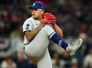 Julio Urias #7 of the Los Angeles Dodgers pitches during Game 2 of the NLCS between the Los Angeles Dodgers and the Atlanta Braves at Truist Park on Sunday, October 17, 2021 in Atlanta, Georgia.