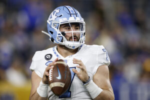 North Carolina Tar Heels quarterback Sam Howell (7) warms up on the sideline during a college football game against the Pittsburgh Panthers on Nov. 11, 2021 at Heinz Field in Pittsburgh, Pennsylvania. 