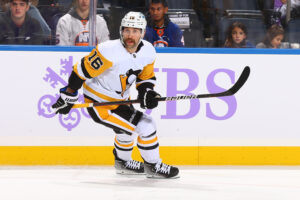 Jason Zucker #16 of the Pittsburgh Penguins skates against New York Islanders at UBS Arena on November 26, 2021 in Elmont, New York. Pittsburgh Penguins defeated the New York Islanders 1-0. 