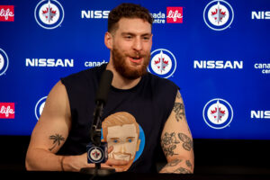 Pierre-Luc Dubois #80 of the Winnipeg Jets takes part in the post-game press conference following a 6-3 victory over the Toronto Maple Leafs at the Canada Life Centre on December 5, 2021 in Winnipeg, Manitoba, Canada. 