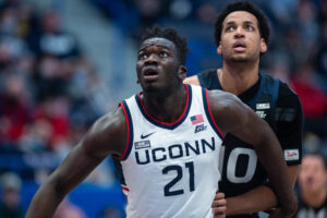 HARTFORD, CT - JANUARY 18: UConn Huskies forward Adama Sanogo (21) blocks out Butler Bulldogs forward Bryce Nze (10) during the mens college basketball game between the Butler Bulldogs and UConn Huskies on January 18, 2022, at XL Center in Hartford, CT.