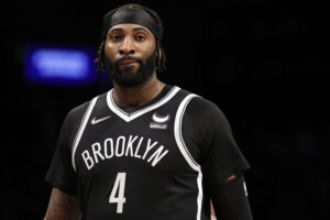 Andre Drummond #4 of the Brooklyn Nets walks off the court during the second half against the Washington Wizards at Barclays Center on February 17, 2022 in New York City. Wizards won 117-103.