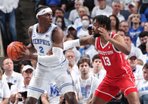 Jalen Duren #2 of the Memphis Tigers dribbles the ball against JWan Roberts #13 of the Houston Cougars during a game on March 6, 2022 at FedExForum in Memphis, Tennessee. Memphis defeated Houston 75-61.