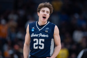 Saint Peter's Peacocks guard Doug Edert (25) celebrates a turnover during the NCAA Division I Mens Basketball Championship Round 2 game between the Murray State Racers and Saint Peters Peacocks on March 19, 2022, at Gainbridge Fieldhouse in Indianapolis, IN.