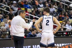 Villanova Wildcats head coach Jay Wright talks to Villanova Wildcats guard Collin Gillespie (2) during the men's March Madness college basketball game 