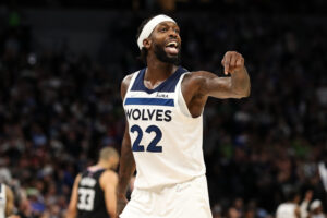 Patrick Beverley #22 of the Minnesota Timberwolves celebrates with fans as time expires against the Los Angeles Clippers in the fourth quarter during a Play-In Tournament game at Target Center on April 12, 2022 in Minneapolis, Minnesota. The Timberwolves won 109-104 to advance to the NBA Playoffs.