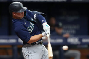 Seattle Mariners first baseman Ty France swings his bat and connects with the baseball for a single against the Tampa Bay Rays