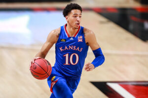 Forward Jalen Wilson #10 of the Kansas Jayhawks handles the ball during the first half of the college basketball game against the Texas Tech Red Raiders at United Supermarkets Arena on December 17, 2020 in Lubbock, Texas.