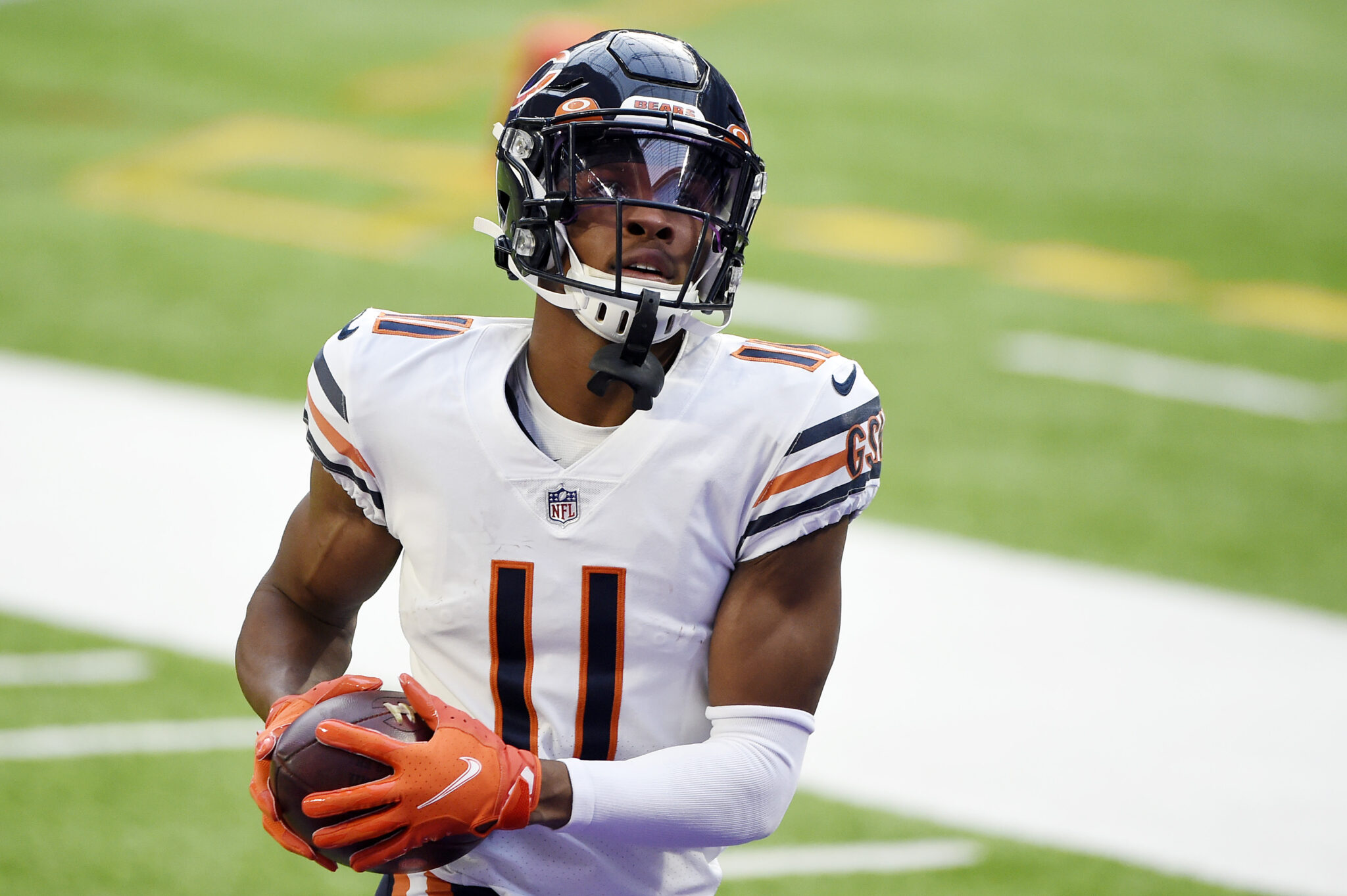 Chicago Bears WR #11 Darnell Mooney warms up before a 2021 road game. 