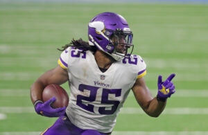 Alexander Mattison #25 of the Minnesota Vikings runs for a first down during the fourth quarter of the game against the Detroit Lions at Ford Field on January 03, 2021 in Detroit, Michigan. Minnesota defeated Detroit 37-35.