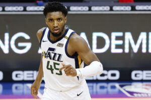 Utah Jazz guard #45 Donovan Mitchell runs back after a made basket in a 2021 home game.