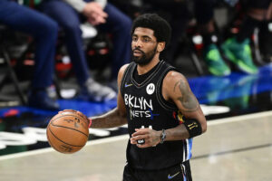 Kyrie Irving #11 of the Brooklyn Nets handles the ball against the Boston Celtics in Game Five of the First Round of the 2021 NBA Playoffs at Barclays Center on June 01, 2021 in the Brooklyn borough of New York City.