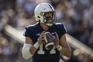 Penn State quarterback Sean Clifford looks downfield for an open receiver while holding the football