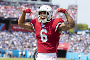 James Conner #6 celebrates with DeAndre Hopkins #10 of the Arizona Cardinals after a touchdown during the game against the Tennessee Titans at Nissan Stadium on September 12, 2021 in Nashville, Tennessee.