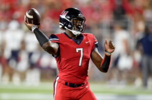 Malik Willis of the Liberty Flames prepares to throw the football down the field