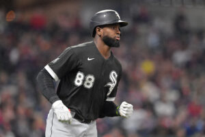 Luis Robert #88 of the Chicago White Sox flies out to center