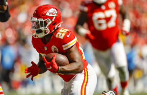 Clyde Edwards-Helaire #25 of the Kansas City Chiefs runs after a pass catch for a 10-yard third quarter touchdown against the Los Angeles Chargers at Arrowhead Stadium on September 26, 2021 in Kansas City, Missouri.