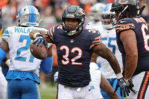 David Montgomery #32 of the Chicago Bears celebrates after a play against the Detroit Lions in the first half at Soldier Field on October 03, 2021 in Chicago, Illinois.