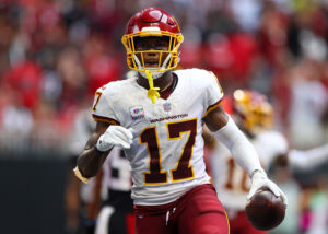 Washington Football Team wide receiver Terry McLaurin holds the football in his left hand after scoring a touchdown