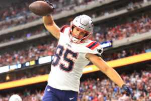 Hunter Henry #85 of the New England Patriots celebrates a touchdown during the second half against the Houston Texans at NRG Stadium on October 10, 2021 in Houston, Texas.