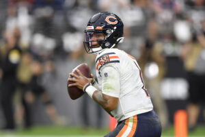 Quarterback Justin Fields #1 of the Chicago Bears looks to throw against the Las Vegas Raiders during the second half of a game at Allegiant Stadium on October 10, 2021 in Las Vegas, Nevada. The Bears defeated the Raiders 20-9.