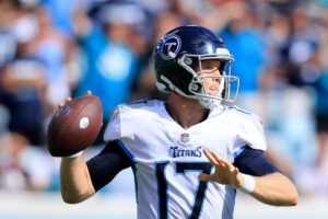 Tennessee Titans quarterback #17 Ryan Tannehill looks downfield in a 2021 game.