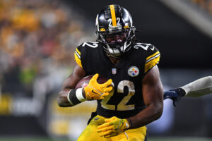 Pittsburgh Steelers running back #22 Najee Harris carries the ball in a 2021 home game.