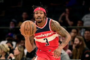 Washington Wizards guard #3 Bradley Beal brings the ball up the court in a 2021 road game.