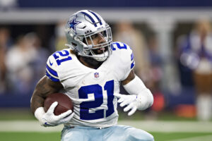 Ezekiel Elliott #21 of the Dallas Cowboys runs the ball during a game against the New York Giants at AT&T Stadium on October 10, 2021 in Arlington, Texas. The Cowboys defeated the Giants 44-20.