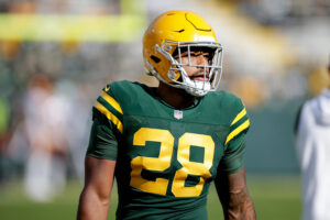 A.J. Dillon #28 of the Green Bay Packers warms up before the game against the Washington Football Team at Lambeau Field on October 24, 2021 in Green Bay, Wisconsin. Green Bay defeated Washington 24-10. 